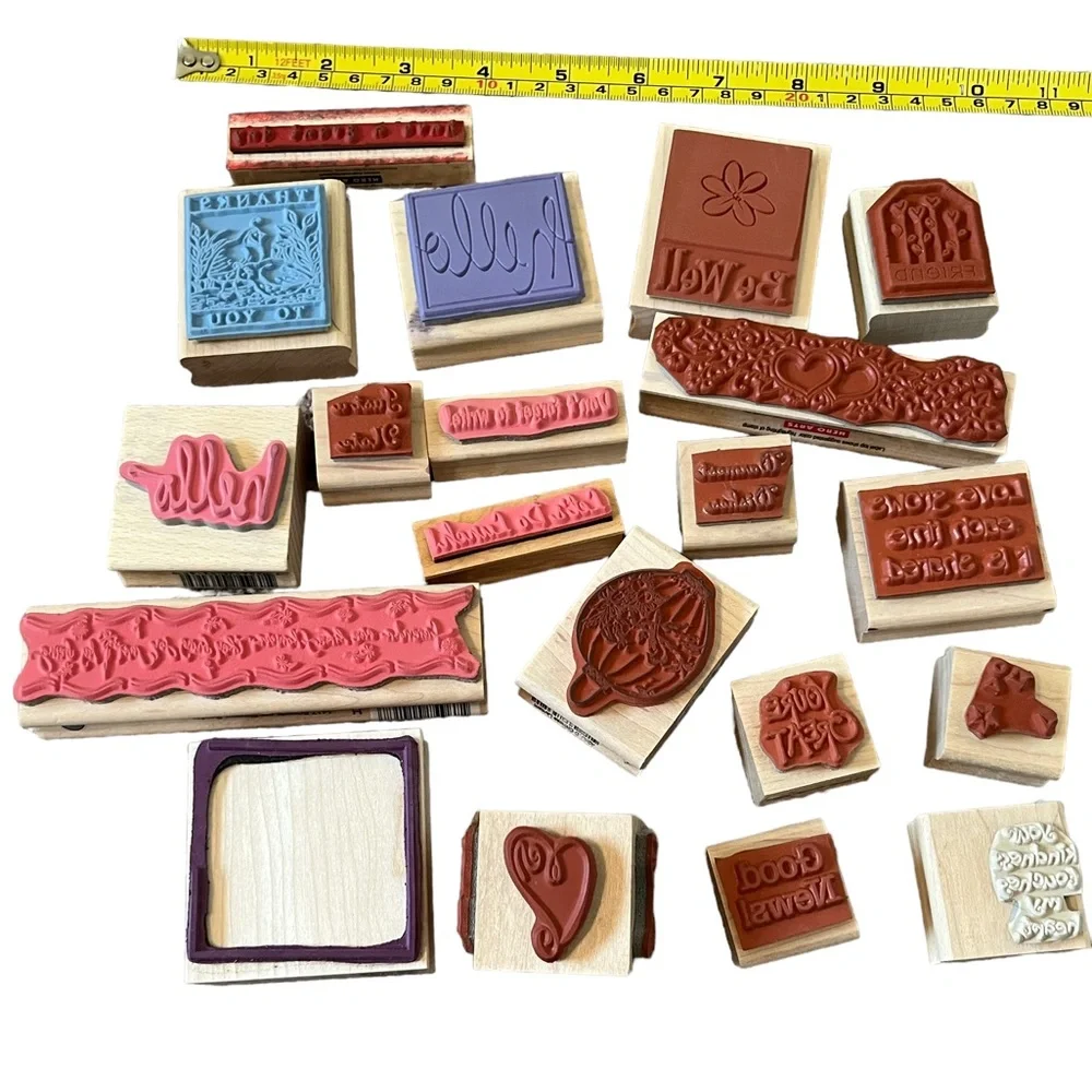 Lot of 20 rubber stamps. Most of the stamps are brand new.